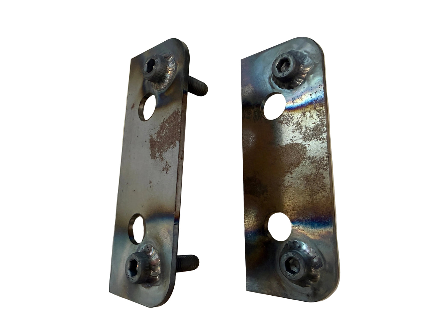 Two metal brackets with screws on a beige background