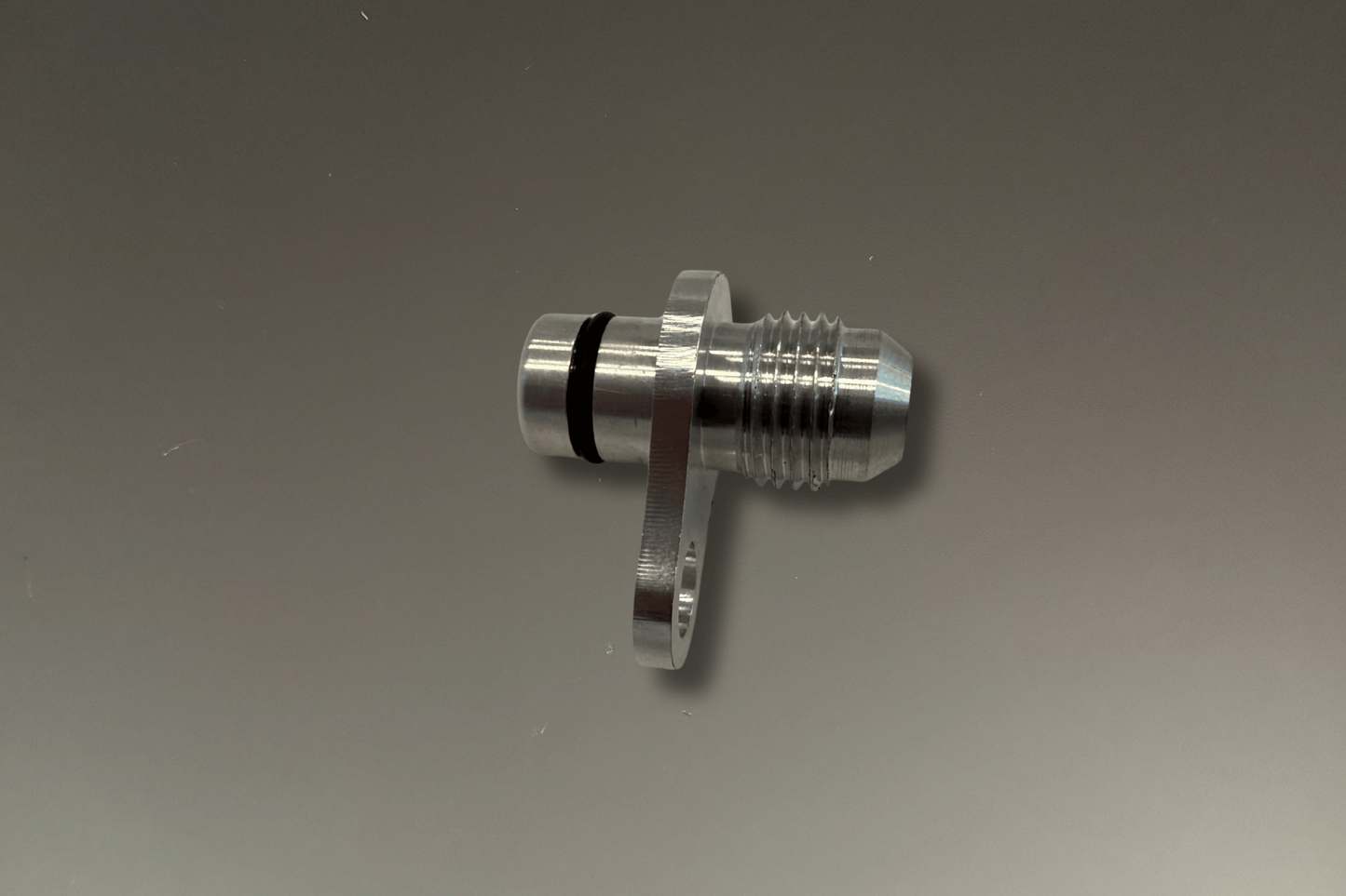 BMW B48 and B58 Coolant and Oil Turbo Fittings -6AN to O-ring - metal fittings with o-ring on a grey background