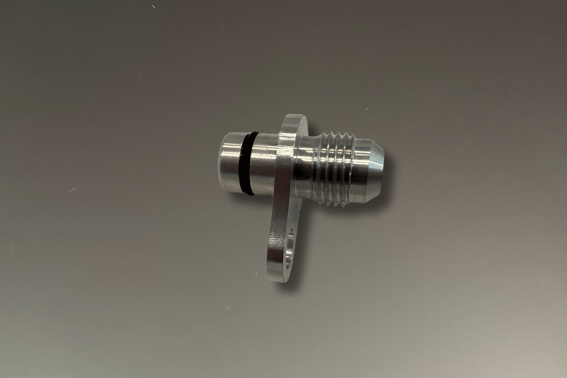 BMW B48 and B58 Coolant and Oil Turbo Fittings -6AN to O-ring - metal fittings with o-ring on a grey background